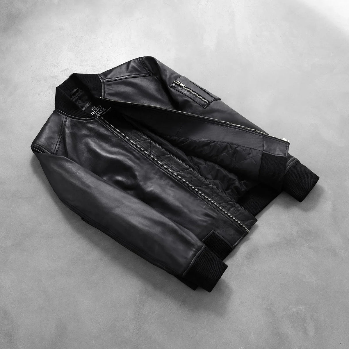 
Styled Fit Perspective of Men's Bomia Ma-1 Black Leather Bomber Jacket on Model - Natural Daylight Drape