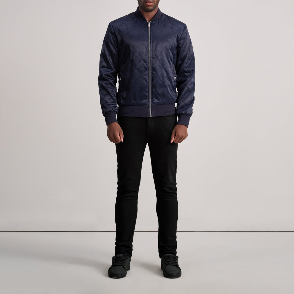 
Close-Up Detail of Varsity & Zipper Hardware on Danson Quilted Blue Varsity Jacket