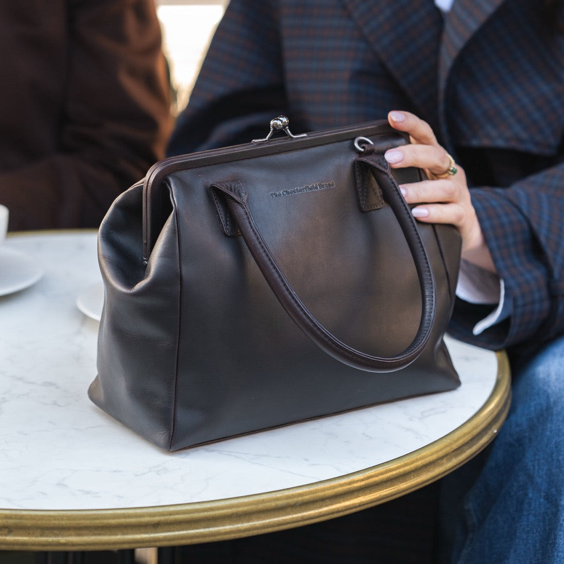 Styled Fit Perspective of Dorin Full-Grain Leather Handbag on Model - Natural Daylight Drape