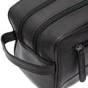 Close-Up Detail of Classic Collar &amp; Heavy-Duty Zipper Hardware on Stacey Full-Grain Leather Toiletry Bag