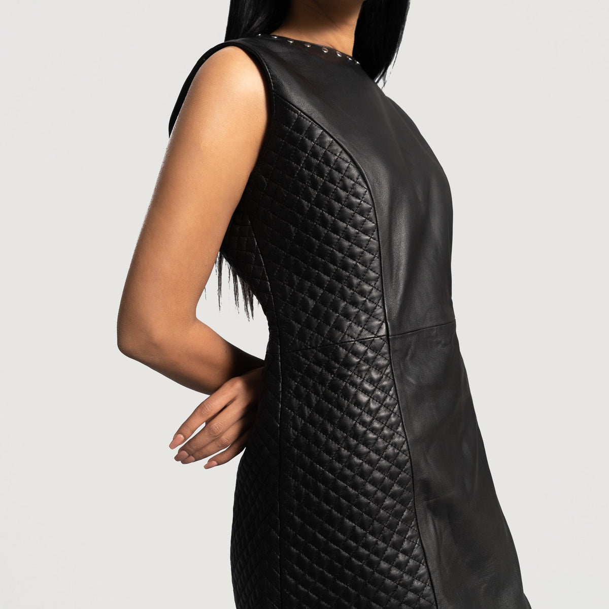 Close-Up Detail of Classic Collar &amp; Zipper on back Hardware on Women's Luxe Black Leather Dress